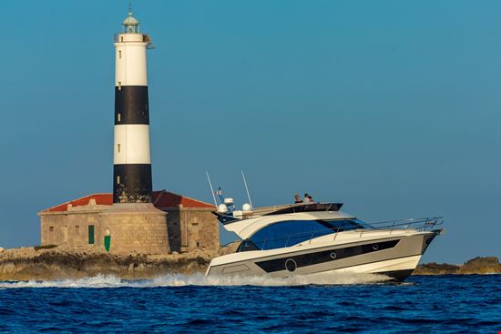 Monte Carlo 52 and a lighthouse