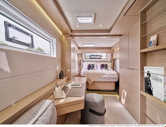 Lagoon 51 owner's cabin with desk and queen sized bed