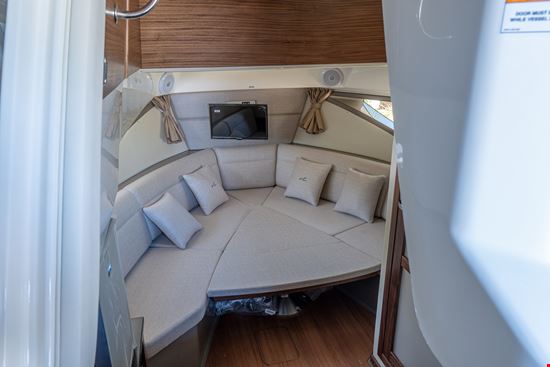 Sea-Ray-Sundancer-320-OB-V-dinette-converted-to-berth-and-TV